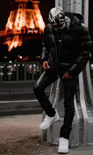 Roddy Ricch’s Outfit in Prada Jacket, Amiri Pants & Supreme Hat (2021)