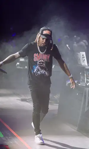 Lil Durk wearing OTF cap