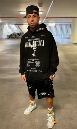 Nicky Jam wearing Gallery Dept. shorts