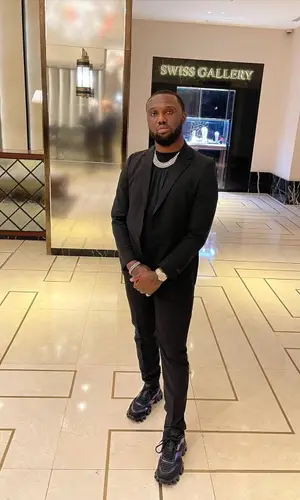 Headie One wearing Prada trousers