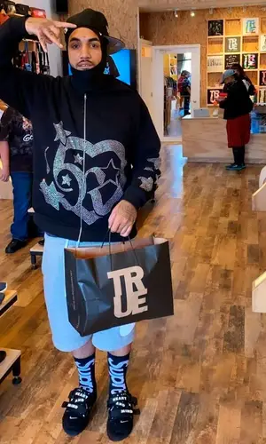 Fenix Flexin wearing Supreme sock