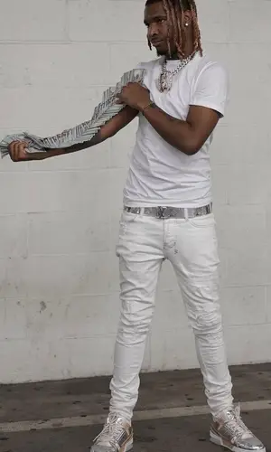 Lil Keed wearing Louis Vuitton belt