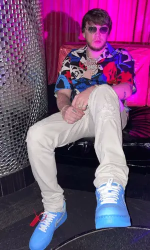 Murda Beatz wearing Alexander McQueen shirt