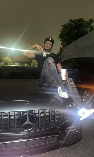Lil Keed wearing Hot Model Sex cap