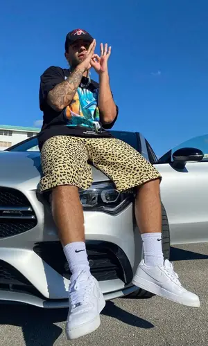 Feid wearing Karol G Merch t-shirt