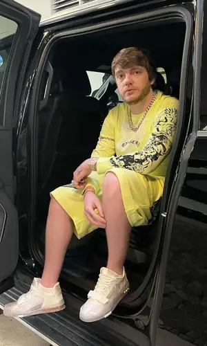 Murda Beatz wearing Givenchy shorts