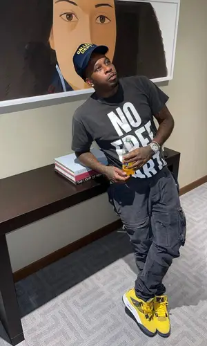 Lil Duke’s Outfit in Cosey X Cosey T-Shirt, Jordan Sneakers & Gallery Dept. Cap (2021)