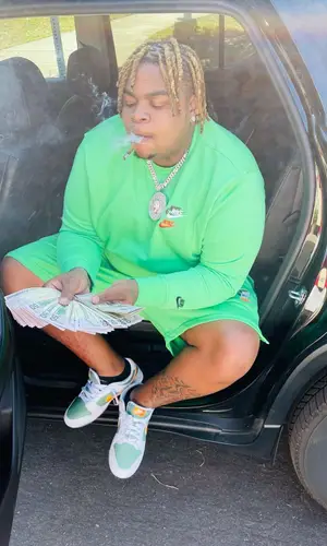 Big Yavo wearing Nike sweatshirt