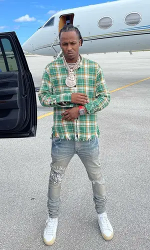 Rich The Kid wearing Greg Lauren shirt