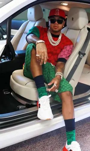 Mazi Vs wearing Gucci shorts