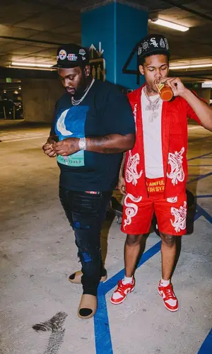Peezy wearing Yeezy sandal