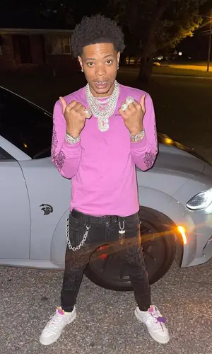 Lil Migo wearing Valabasas jeans