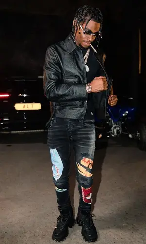 Russ Millions wearing Polo Ralph Lauren t-shirt