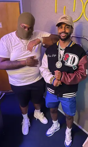 Peezy wearing Adidas sock