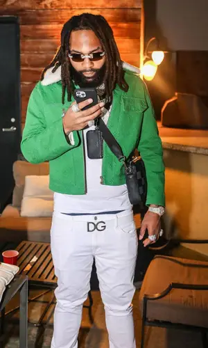 Money Man wearing Louis Vuitton bag