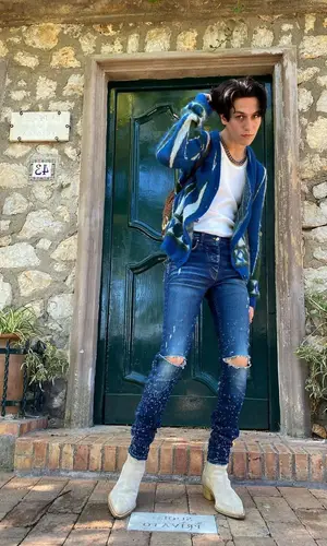 Lil Huddy wearing Amiri boots