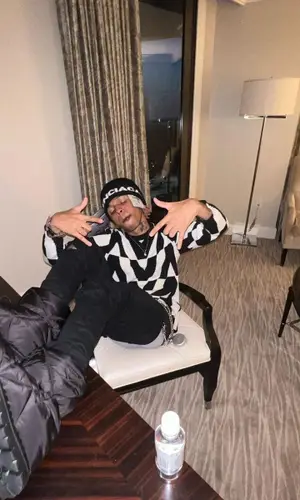 SoFaygo wearing Prada boots