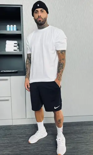 Nicky Jam wearing Obey hat