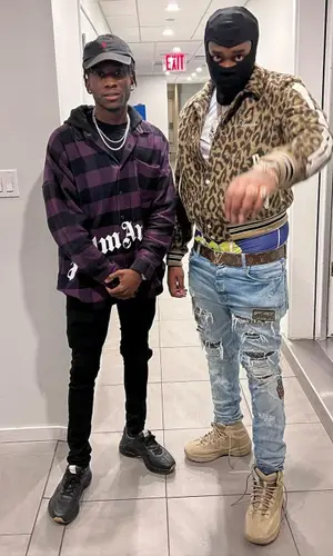 Fivio Foreign wearing Yeezy boots