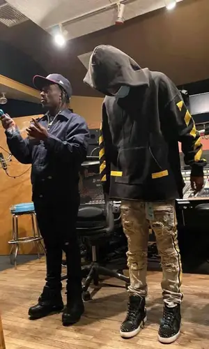 YN Jay wearing Preme jeans