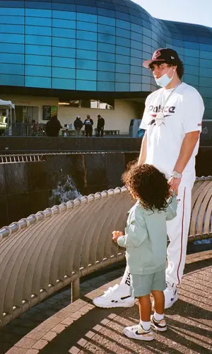 OhGeesy wearing Palace sneakers