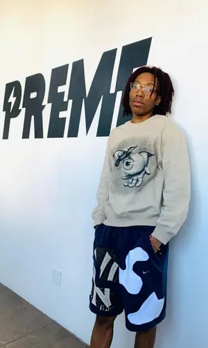 Lil Tecca wearing AceRetroGrade shorts