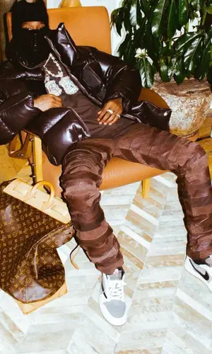 Travis Scott wearing Nike sneakers