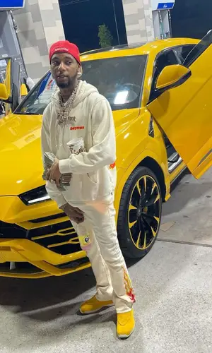 Key Glock wearing Mitchell & Ness cap