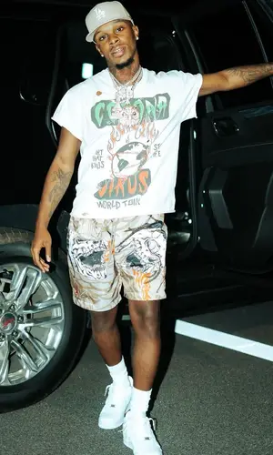 Toosii wearing Jordan shorts