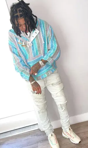 Young M.A wearing Rassvet hoody