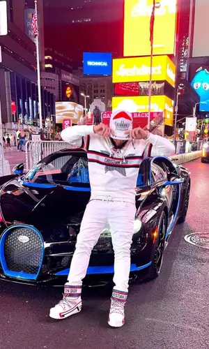 El Alfa El Jefe wearing Dior boots