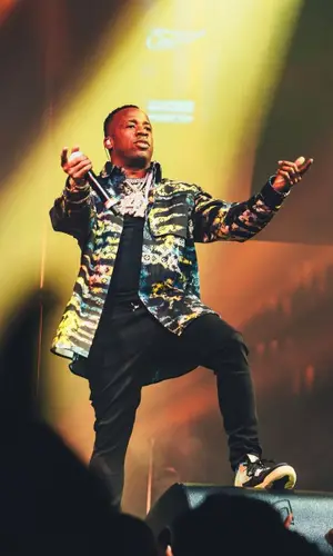 Yo Gotti wearing Amiri jeans