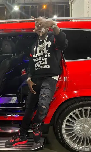 DaBaby wearing Amiri jeans