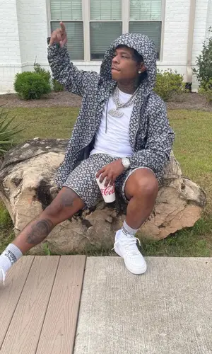 Rylo Rodriguez wearing Burberry shorts