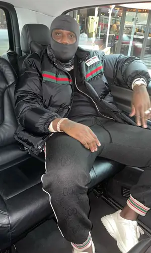 Headie One wearing Gucci jacket