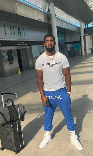 Tion Wayne wearing Louis Vuitton bag