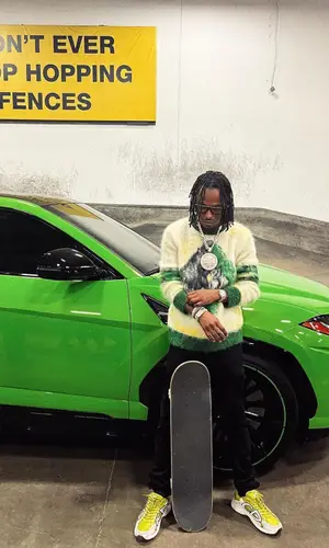 Rich The Kid wearing Dior sweater