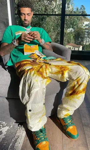 PnB Rock wearing Louis Vuitton sneakers
