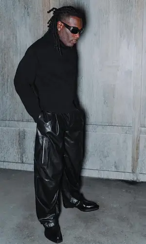 Burna Boy wearing Bottega Veneta sweater