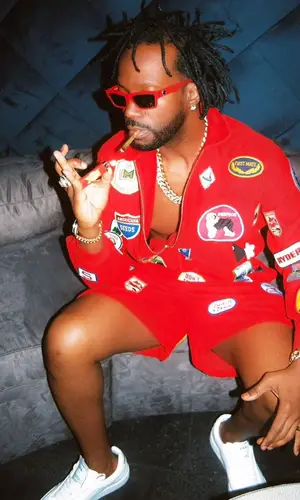 Juicy J wearing Bode jacket