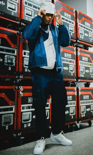 Myke Towers wearing Prada backpack