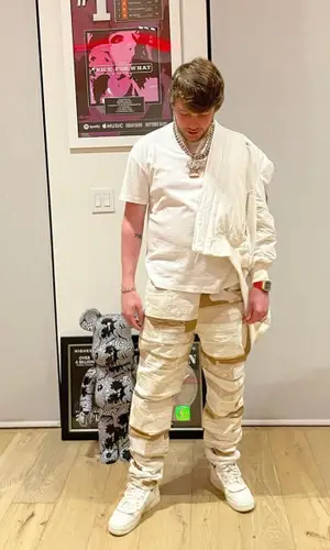 Murda Beatz wearing Givenchy jeans