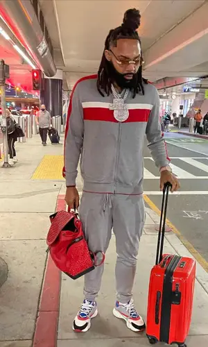 Money Man wearing Stefano Ricci pants