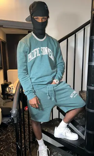 Toosii wearing PacSun shorts