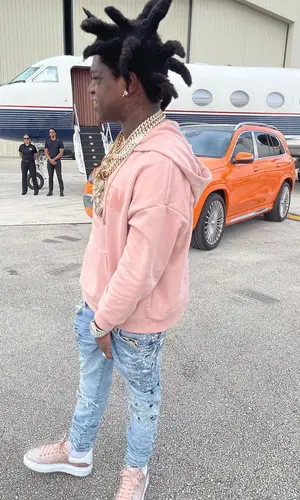 Kodak Black wearing Alexander McQueen hoody