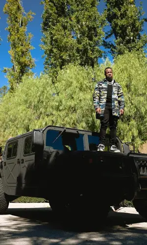 Yo Gotti wearing Amiri jeans