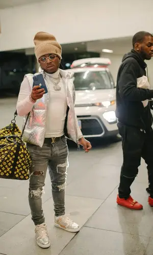 Jacquees wearing Louis Vuitton top