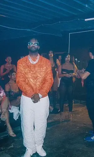 Juicy J wearing Louis Vuitton jacket