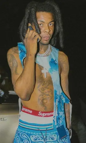 Yak Gotti wearing Supreme shorts