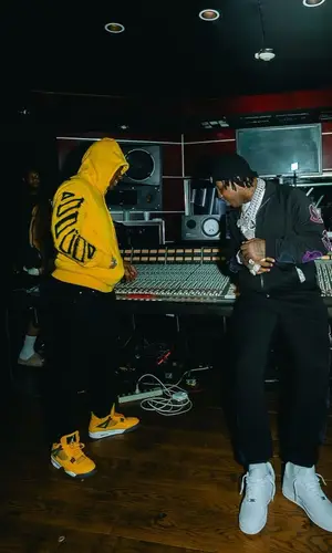 EST Gee wearing Moncler sweatshirt